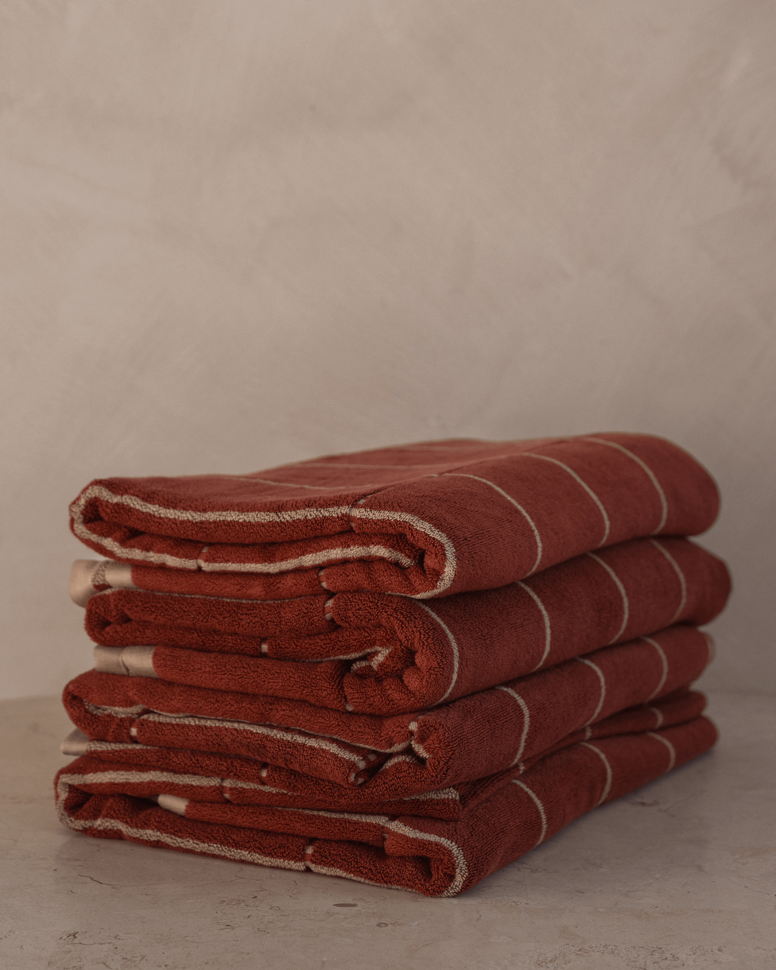 Set of four Auburn bamboo cotton bath towels stacked, Sand Society