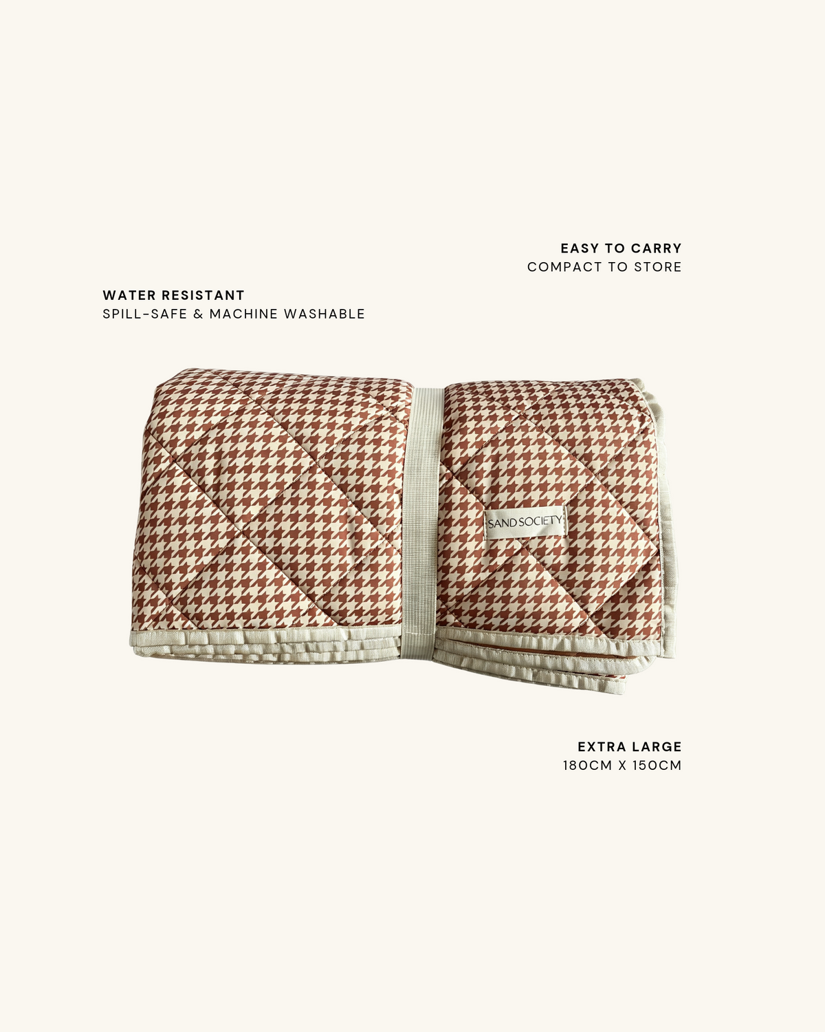 Biscuit picnic blanket folded with its strap. Water resistant: spill-safe and machine washable. Easy to carry: compact to store. Extra large: 180 x 150cm