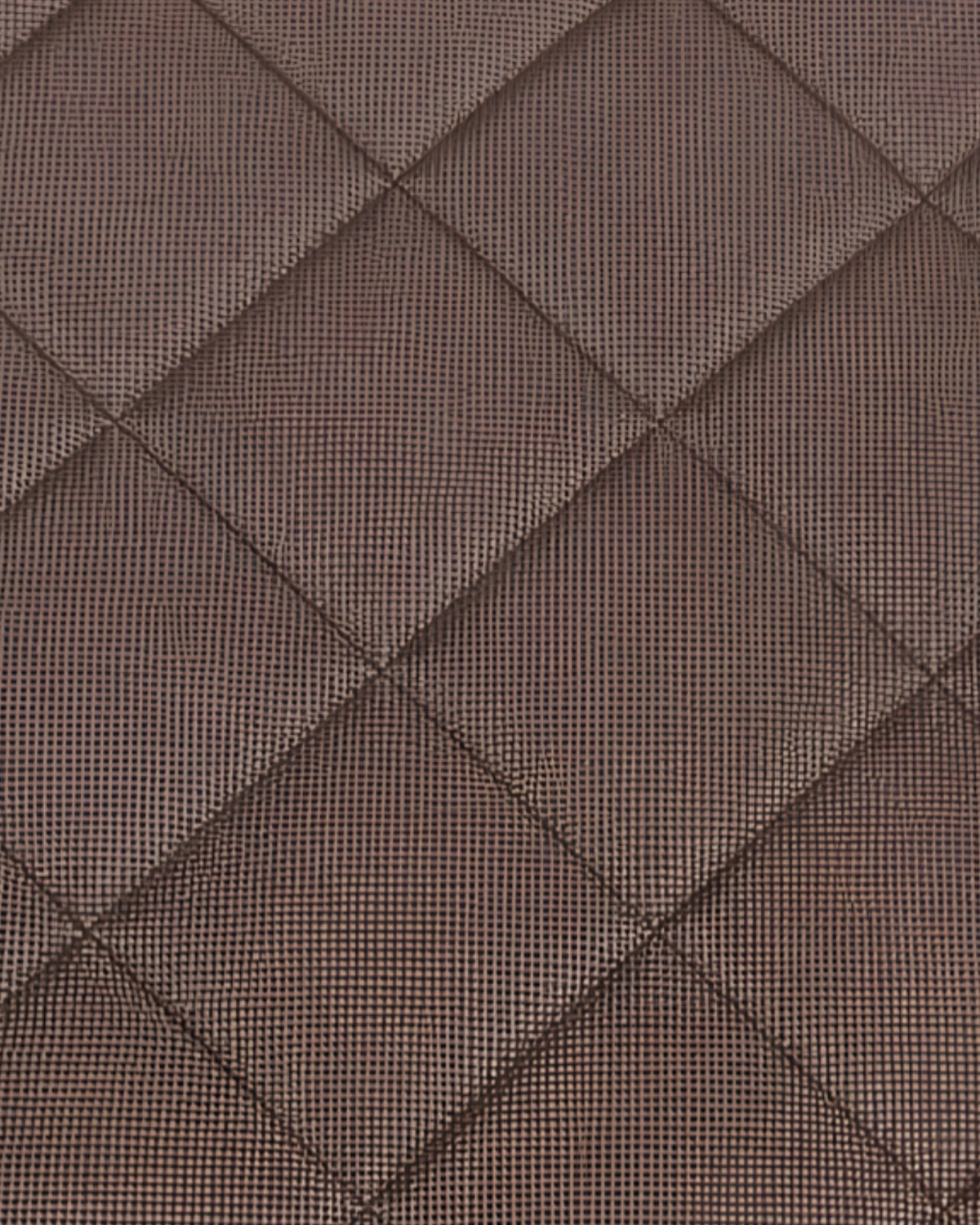 Close-up of the chocolate gingham picnic blanket's quilted diamond stitching